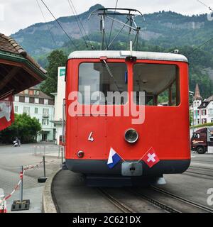Vitznau, Switzerland - June 14, 2017: The passenger tourist red train at the station before going the top Rigi Kulm mountain Stock Photo