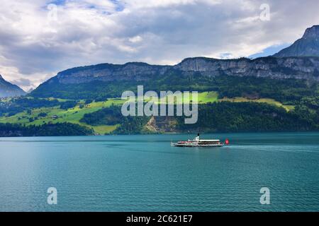 Vitznau, Switzerland - June 14, 2017: The steam boat 'Schiller' on the lake Luzern. Cruise on a lakes is one of the most popular tourist attractions i Stock Photo