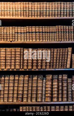 Shelves full of many old books. Stock Photo