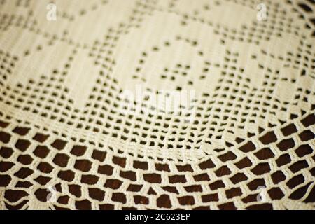 White crocheted napkin with floral pattern close up Stock Photo