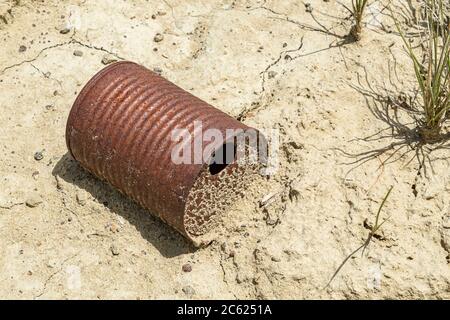 Old rusty metal tin can littering , Wyoming USA Stock Photo