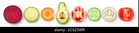 Isolated vegetable pieces. Raw vegetables slices of different color and shape (beetroot, zucchini, carrot, avocado, bell pepper, cucumber, eggplant, t Stock Photo