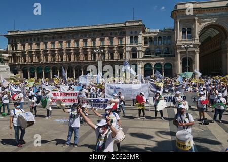 Milan, Italy. 04th July, 2020. Hundreds of flags, T-shirts, banners, signs with the word 'Respect' invaded the center on the occasion of the national mobilization of nurses and health personnel called by the national union Nursing Up in Duomo square Milan. (Photo by Luca Ponti/Pacific Press/Sipa USA) Credit: Sipa USA/Alamy Live News Stock Photo
