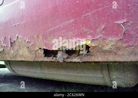 Corrosion of metal, rust on the doorstep of a car. Stock Photo