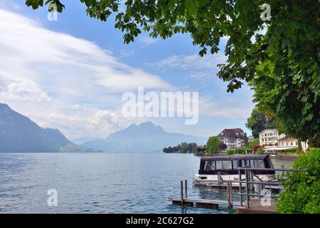 Vitznau, Switzerland - June 14, 2017: Beautiful view on the lake Luzern nearby city of Vitznau. Mountain Pilatus on background Stock Photo