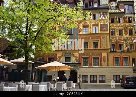 LUCERNE, SWITZERLAND - JUNE 14, 2017: Street cafe abd picturesque architecture nearby Weinmarkt square in Luzerne, hotel des Balances on background Stock Photo