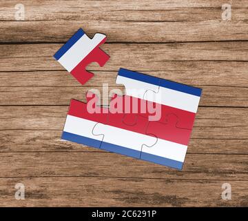 Costa Rica national flag on jigsaw puzzle. One piece is missing. Danger concept. Stock Photo