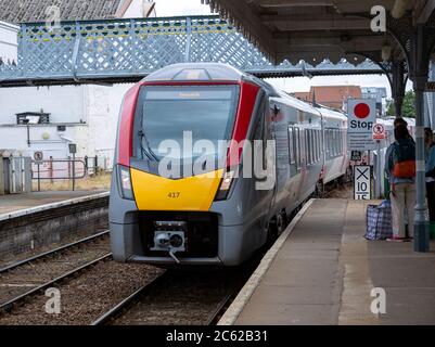 British Rail Class 755 Stadler bi-modal train arriving at railway station Woodbridge, Suffolk, England, UK destination Ipswich Stock Photo