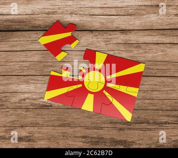 Macedonia national flag on jigsaw puzzle. One piece is missing. Danger concept. Stock Photo