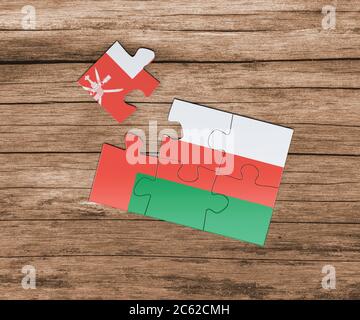 Oman national flag on jigsaw puzzle. One piece is missing. Danger concept. Stock Photo