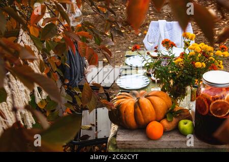 Autumn brunch table in the backyard with pumpkin and yellow decor Stock  Photo - Alamy