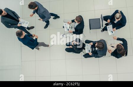 boss congratulating the best employee during a work meeting. Stock Photo