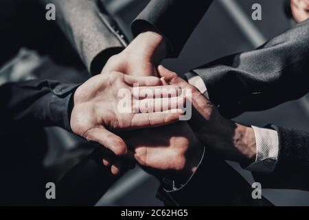 close up. young business people joining their palms together. Stock Photo