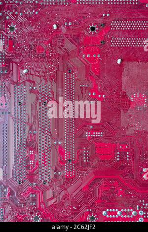 Pink computer circuit board. Hardware components. Close-up, background Stock Photo