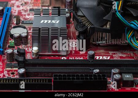 Ukraine - April 25, 2020: Computer motherboard (socket) with cooling fan. Hardware components. View inside, background, close-up, top view Stock Photo
