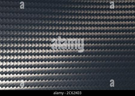Macro photo of grey carbon fiber pattern texture surface. Texture and pattern background. Modern technology and material concept. Stock Photo