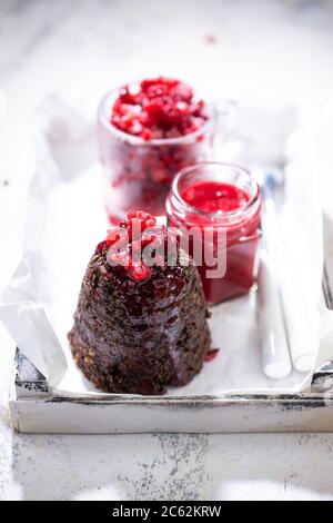 Chocolate cupcake with fruit.Dessert with raspberries.Muffin with fruit sauce.Low fat food and drink. Stock Photo