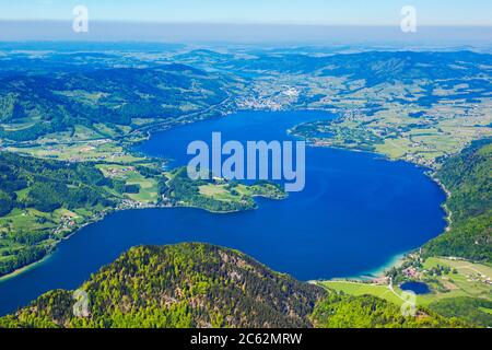Mondsee or Moon lake aerial panoramic view from Schafberg viewpoint, Upper Austria. Mondsee lake located in the Salzkammergut region of Austria near S Stock Photo