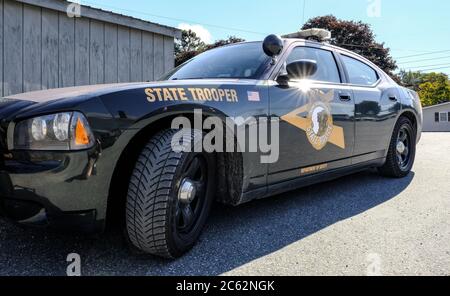Parked up state trooper police vehicle showing the detail of the vehicle as seen parked in a nearby lay-by. Stock Photo