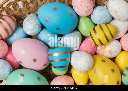colorful Easter eggs in different sizes close-up. Easter background. Stock Photo