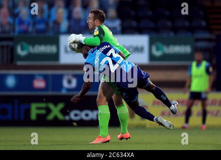 Fleetwood Town goalkeeper Alex Cairns claims the ball off the head of Wycombe Wanderers’ Fred Onyedinma during the Sky Bet League One play-off semi-final, second leg match at Adams Park, Wycombe. Stock Photo