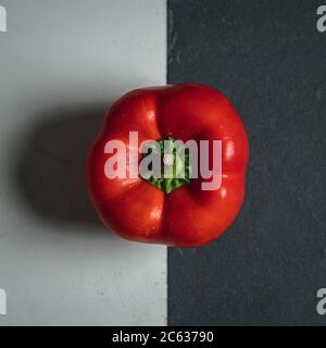 Red Pepper on Black and White Background Flatlay Stock Photo