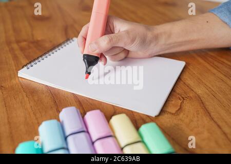 Drawing on a white sheet with a color highlighter Stock Photo