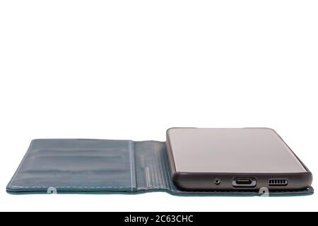 Close up view of mobile phone in green case isolated on white background. Communication concept. Stock Photo