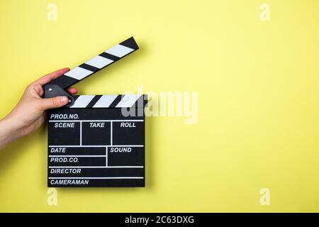 Movie clapper on yellow background, cinema concept Stock Photo