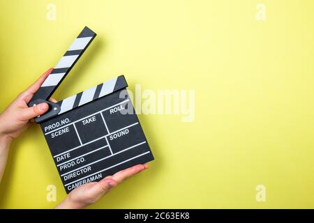 Movie clapper on yellow background, cinema concept Stock Photo