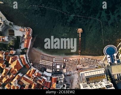 Montenegro. The old town of Budva. The view from the top. Orange roofs of the old town. Beach in the Adriatic sea Stock Photo