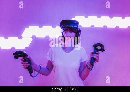 Girl playing virtual reality games. Home entertainment. Stock Photo