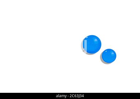 Blue water or cosmetic drop on white background. Fluid transparent liquid gel drop. Cosmetic skin care product texture Stock Photo
