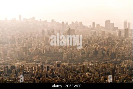 An aerial view of the downtown area of the city of Beirut and coast on a hot day and covered in smog, haze and pollution, Lebanon. Stock Photo