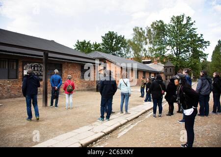 Polish or Pole people and foreign traveler group tour travel visit learn historic at Auschwitz Nazi concentration and extermination camp in Oswiecim o Stock Photo