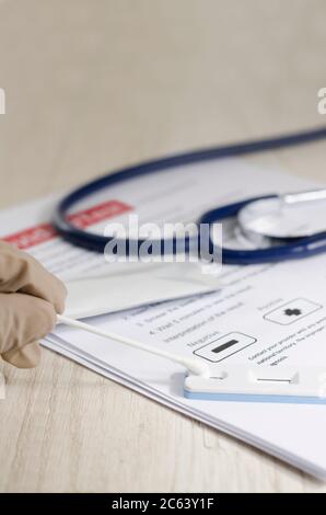 Laboratory scientist performs a rapid diagnostic test (rdt) for antibodies to detect the presence of viral proteins. caused by coronavirus disease COV Stock Photo