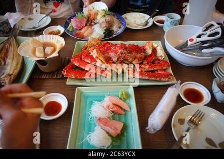King Crab or whole Taraba crab, scallops, hokke fish, sashimi, premium Japanese food. Stock Photo