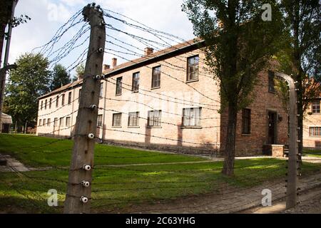 Polish or Pole people and foreign traveler group tour travel visit learn historic at Auschwitz Nazi concentration and extermination camp in Oswiecim o Stock Photo