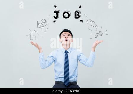 Portrait of young desperate Asian man thinking about job in isolated studio light gray background Stock Photo