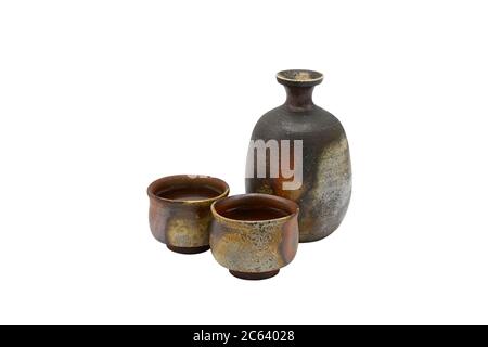 Jar and cup made from terracotta on a white background, Japanese style, used for tea or sake wish clipping path. Stock Photo
