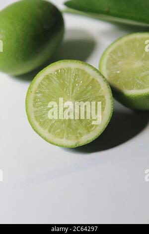 isolated Sliced lemon on white surface Stock Photo