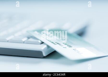 Bank creadit card on keyboard. Concept of online banking and internet purchase. Soft focus. Stock Photo