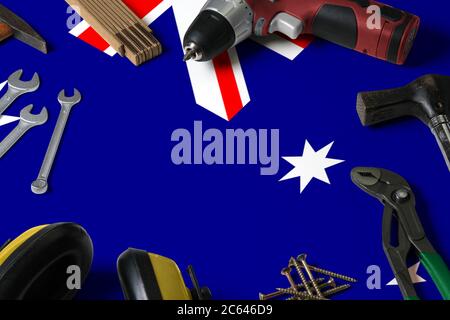 Australia flag on repair tool concept wooden table background. Mechanical service theme with national objects. Stock Photo