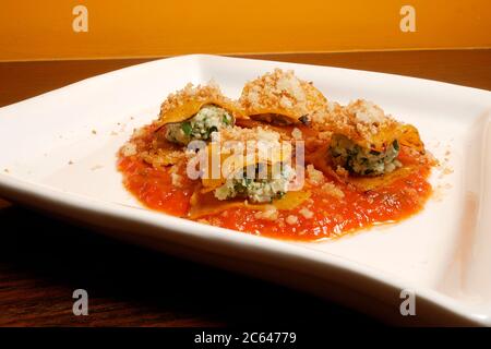 PUMKIN  RAVIOLI STACKS  WITH BALLS OF COTTAGE CHEESE AND SPINACH Stock Photo