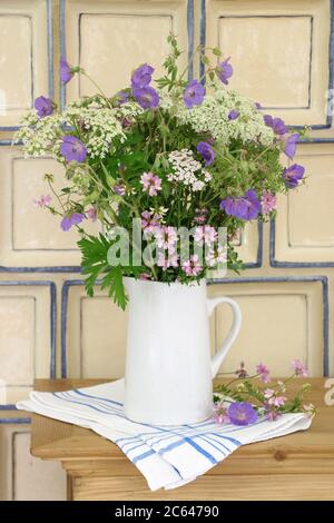 bouquet of meadow flowers in purple and white in vase Stock Photo