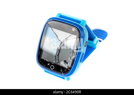 Multicolored kids smart watch phone with broken screen isolated on white background. Technology for children. Wearable gadget concept. Top view, close Stock Photo