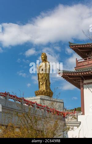 Golden Guan Yin statue at Dalian Hengshan Temple Stock Photo