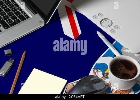 Falkland Islands national flag on top view work space of creative designer with laptop, computer keyboard, usb drive, graphic tablet, coffee cup, mous Stock Photo