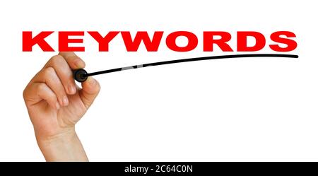 Hand underlining keywords with red marker Stock Photo