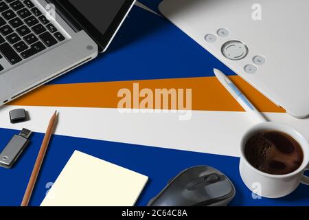 Marshall Islands national flag on top view work space of creative designer with laptop, computer keyboard, usb drive, graphic tablet, coffee cup, mous Stock Photo